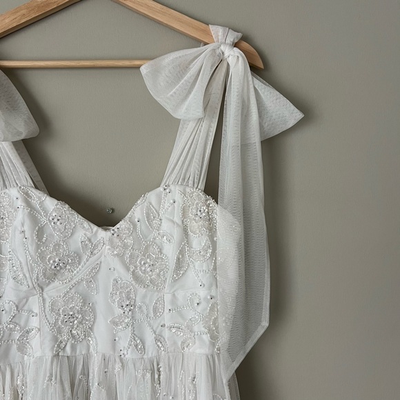 ASOS DESIGN Mila Floral Embellished Mesh Wedding Dress with Tie Straps in Ivory - Picture 6 of 8